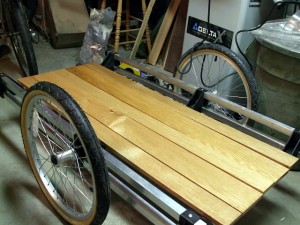 The oak slats get a dry fit before being secured to the trailer frame The oak slats, dry after a third coat of Varathane, get a dry fit before being secured to the trailer frame.