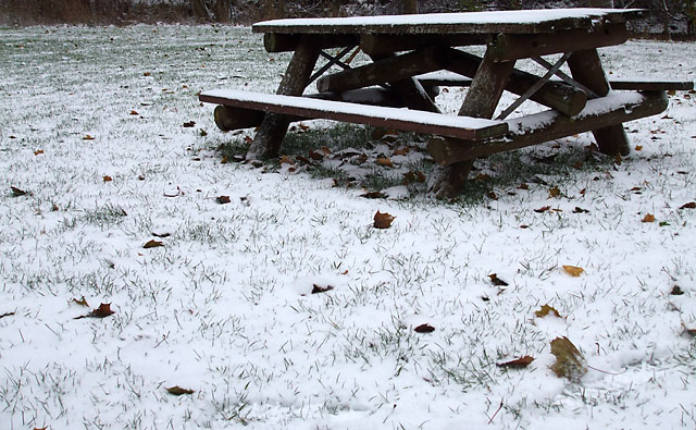 Snow-dusted picnic table