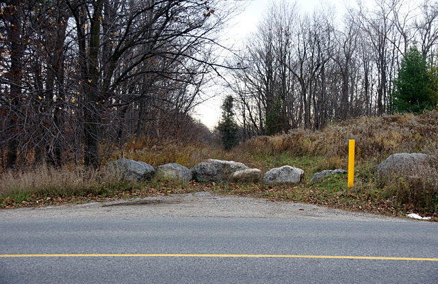 A row of rocks blocks access to Passmore Avenue from Reesor Road