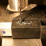 The brackets are already drilled to secure the crosspieces. I drilled out the crosspieces for pop rivets, but if you