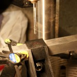 You need to drill holes in the brackets for both the top and bottom tubes that run the length of each side of the trailer. If you use self-tapping screws rather than pop rivets, you don