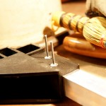 Insert a pop rivet into each hole in the bracket and tube.