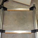The wooden crosspieces have been mounted to the frame and are ready for the slats to be fastened. I chose this design rather than attaching the slats directly to the aluminum crosspieces because it means that the entire bed is attached to the trailer frame with only six screws, greatly easing any future replacement or maintenance.