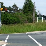 At the intersection of <a href="http://maps.google.com/maps?q=Dufferin+Street+%26+King+Road,+King&ie=UTF8&t=h&z=16&iwloc=A">Dufferin & King Road</a>, they put in pedestrian signals and curb cuts, but forgot the sidewalks. This seems to be a <a href="http://valdodge.com/2008/08/06/pedestrian-infrastructure-suburban-style/">common occurrence</a> in the rural ring around Toronto.