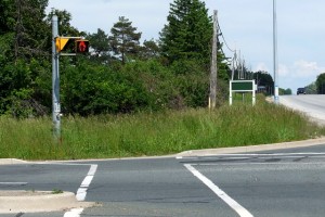 At the intersection of Dufferin & King Road, they put in pedestrian signals and curb cuts, but forgot the sidewalks. This seems to be a common occurrence in the rural ring around Toronto.