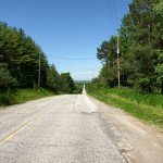 North of Highway 9, Dufferin regains its pavement and descends into the Holland Marsh.
