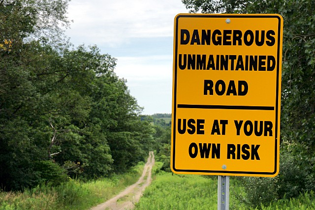 Dangerous unmaintained road Dangerous unmaintained road sign