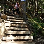 The three-quarter mark comes at the top of a staircase, a tough 30 minutes after the last marker. Assistance ropes are more common through this stretch of trail.