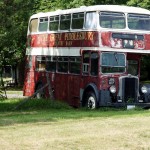 A little farther down the road, The Great Piddlesbury Country Barn bus sits on the lawn in front of its eponymous barn.